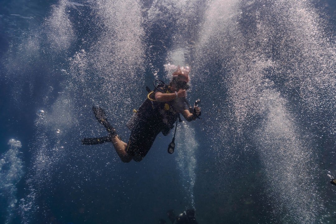 diver equalizing ears underwater