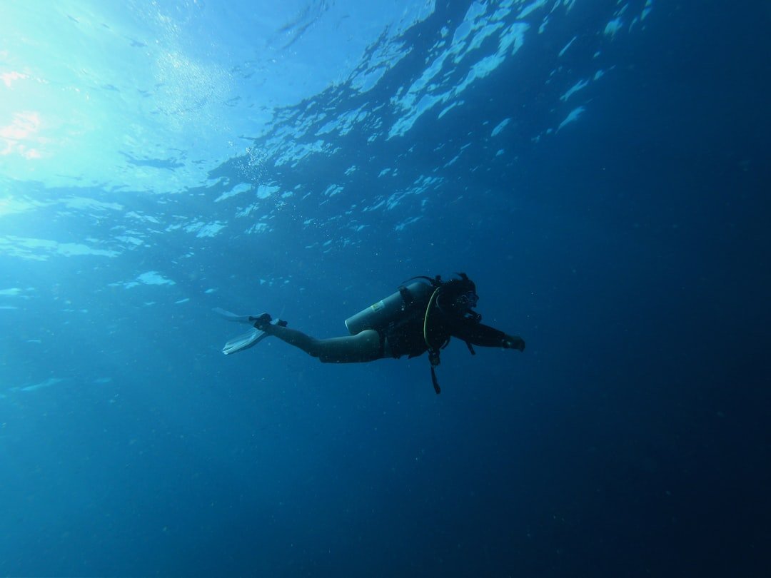 scuba diver underwater breathing calmly