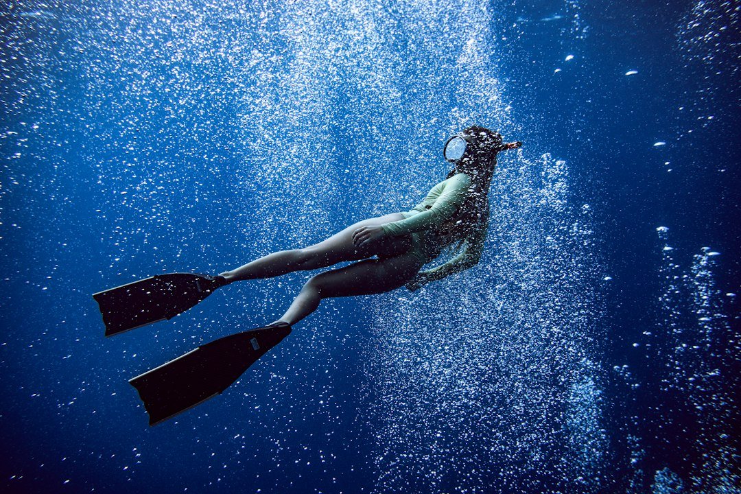 diver in wetsuit underwater